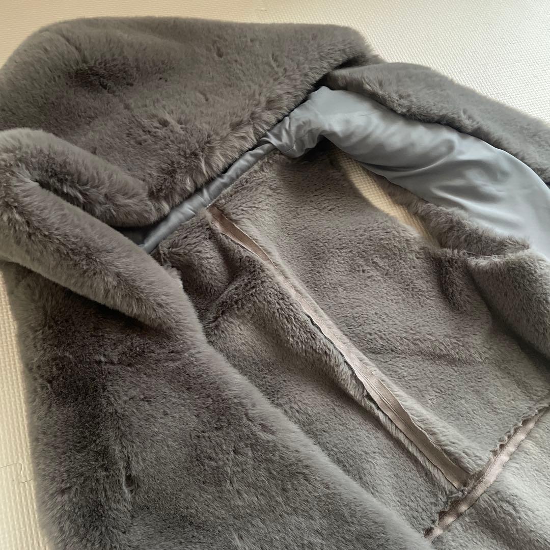 【値下げ】PASSIONE パシオーネ　フェークファー　フード付きベスト