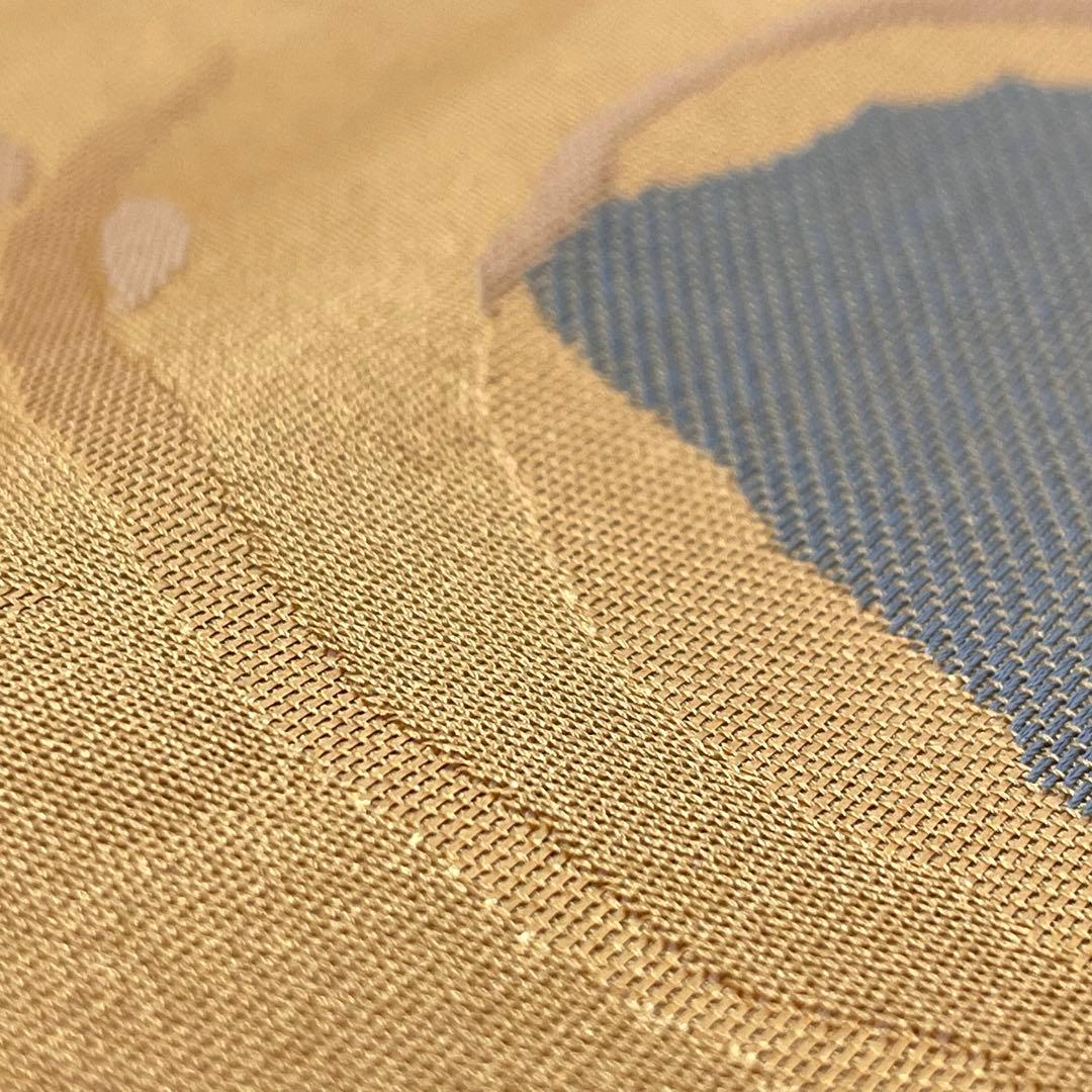 ［ 名古屋帯/ポリエステル ］化繊　柔らかい橙系の色　蝶　洗濯　洗える