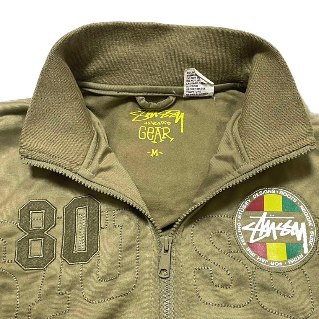 ステューシー トラックジャケット ラスタカラー 刺繍ロゴ ジャージ カーキ系 M
