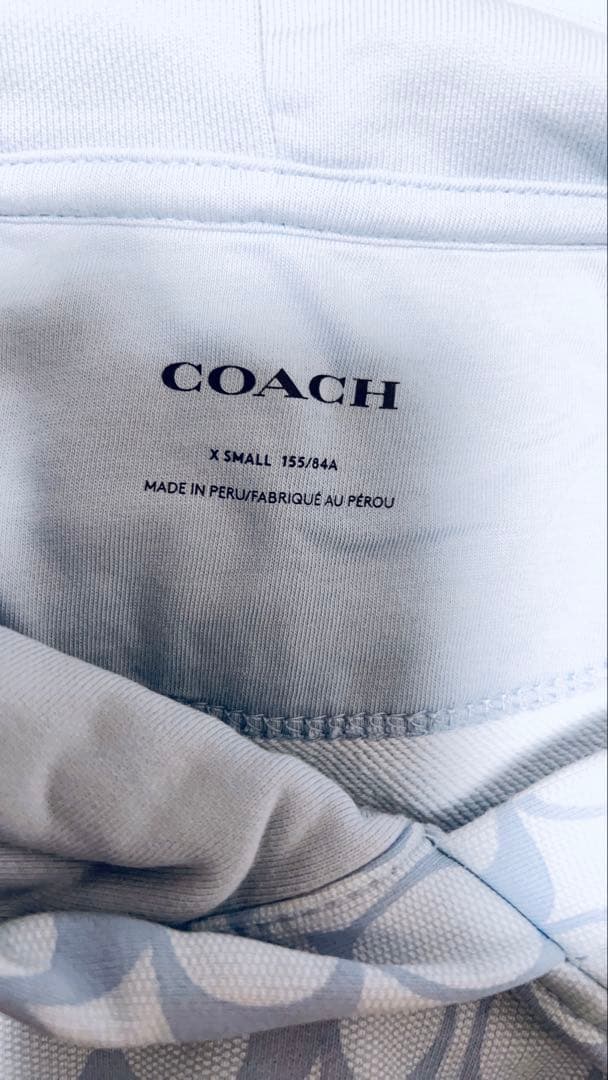 COACH 水色 フード付きパーカー