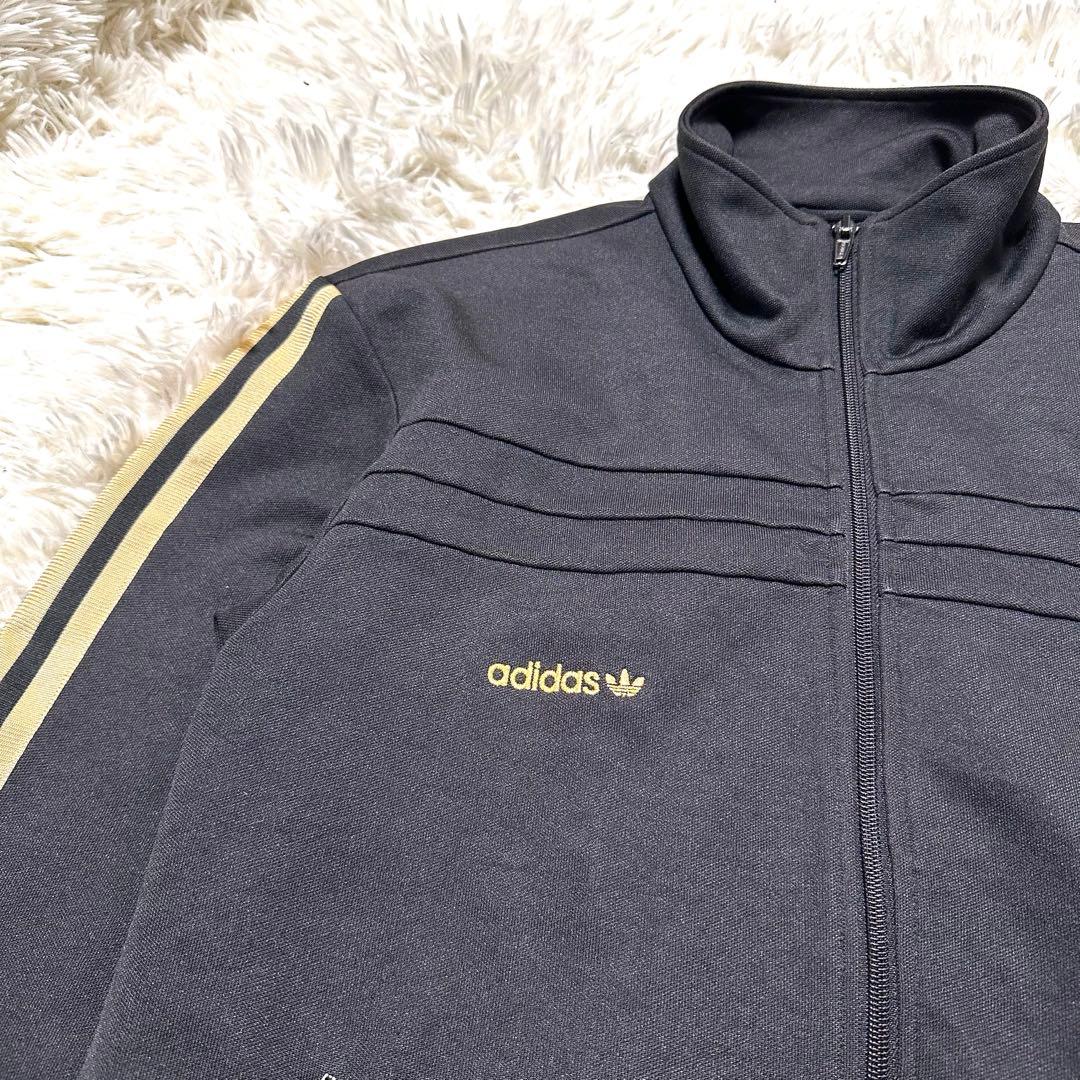 アディダス トレフォイル ロゴ刺繍 トラックジャケット ブラック 黒 金色