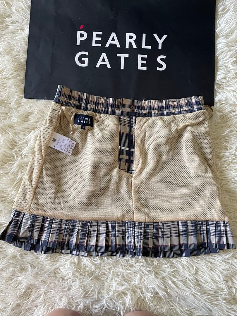 パーリーゲイツ 【軽量保温】バックロゴプリーツ切替タフタスカートサイズ0