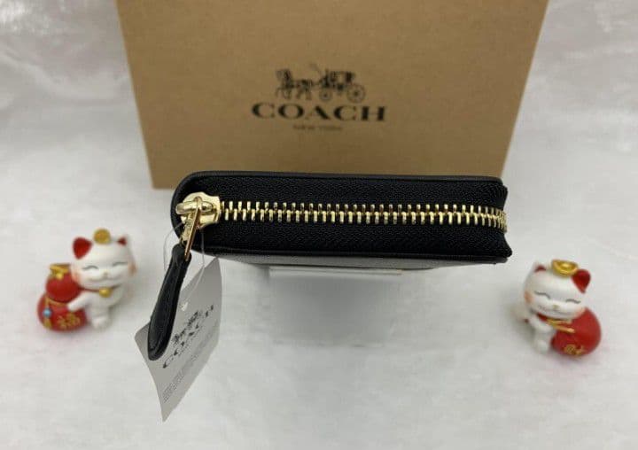 新品未使用コーチ長財布ブラウンブラックシグネチャーレディースメンズ送料無料