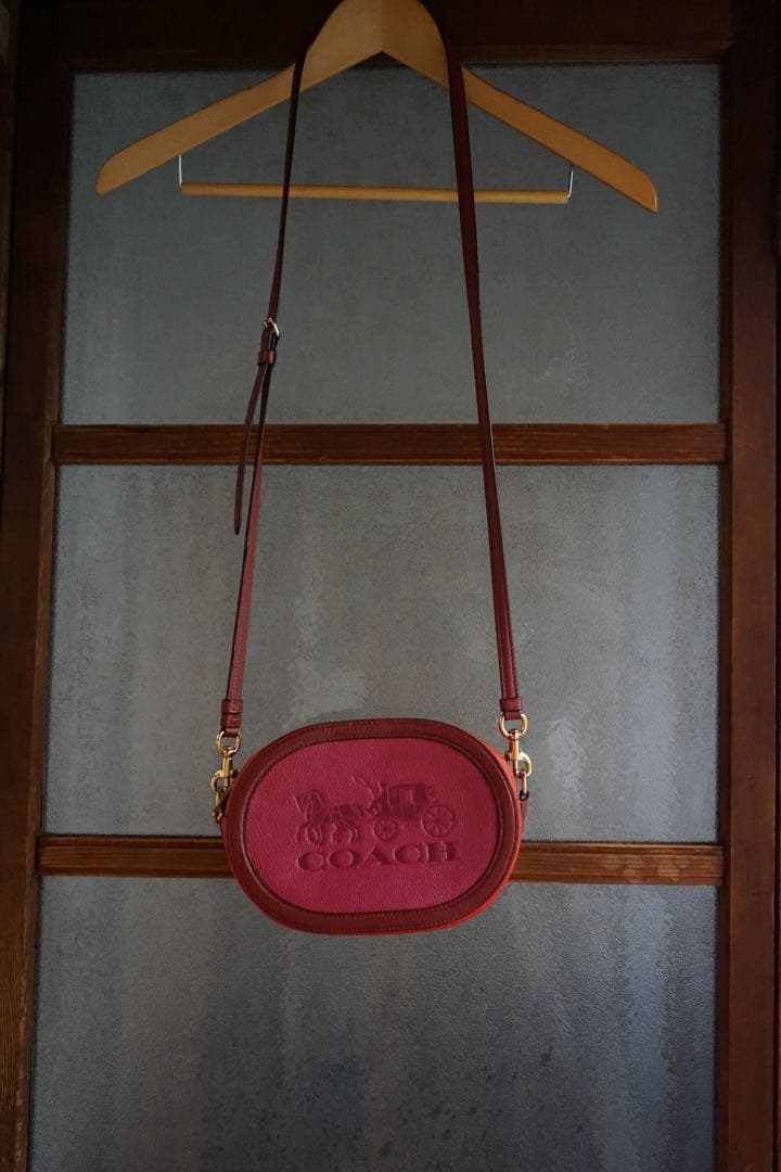coach赤とオレンジバイカラーオーバルポシェット