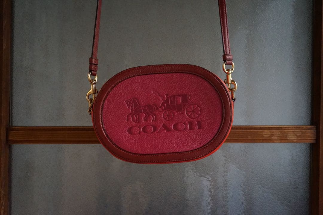 coach赤とオレンジバイカラーオーバルポシェット