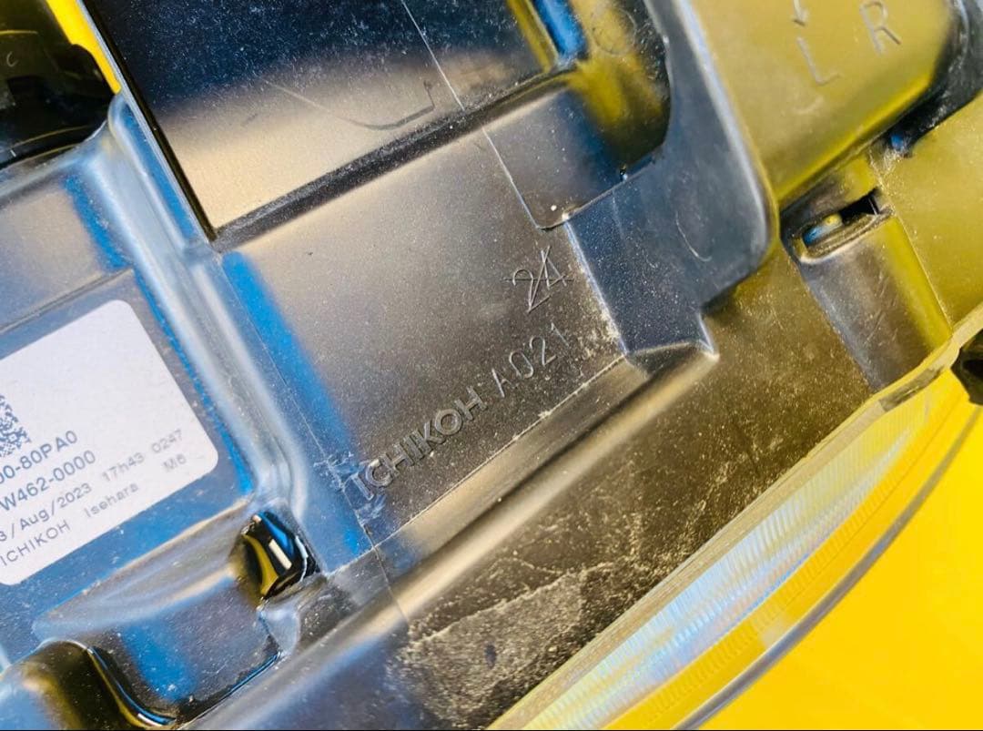 スズキラパンHE33S 左ヘッドライトICHIKOHA021