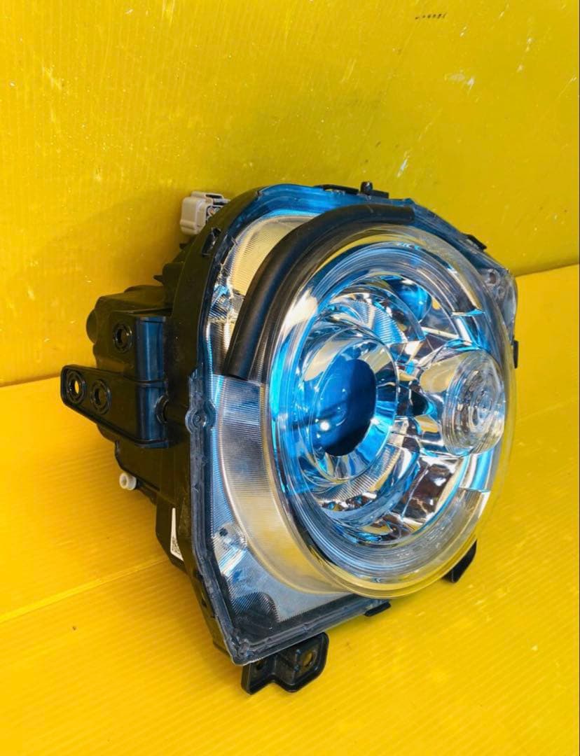 スズキラパンHE33S 左ヘッドライトICHIKOHA021