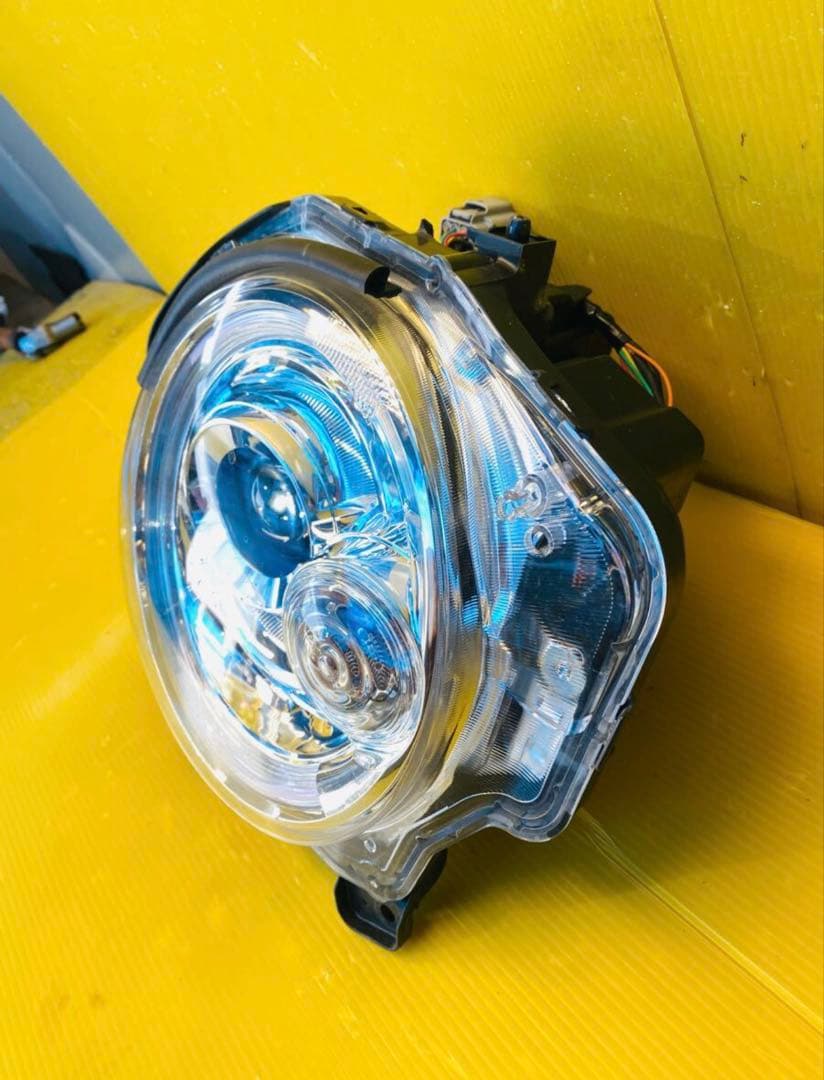 スズキラパンHE33S 左ヘッドライトICHIKOHA021