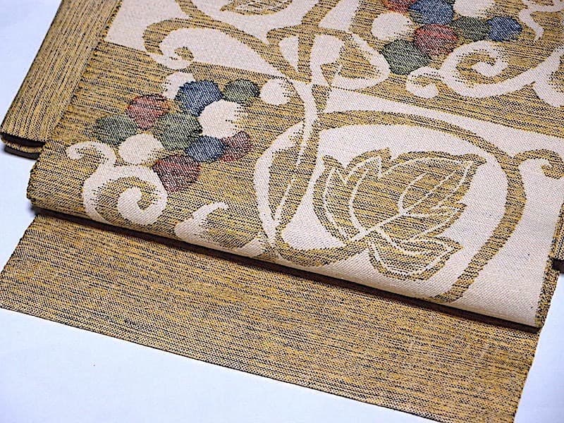 西陣織　紬八寸名古屋帯（市松に葡萄葉文）長366　三幸織物　正絹美品