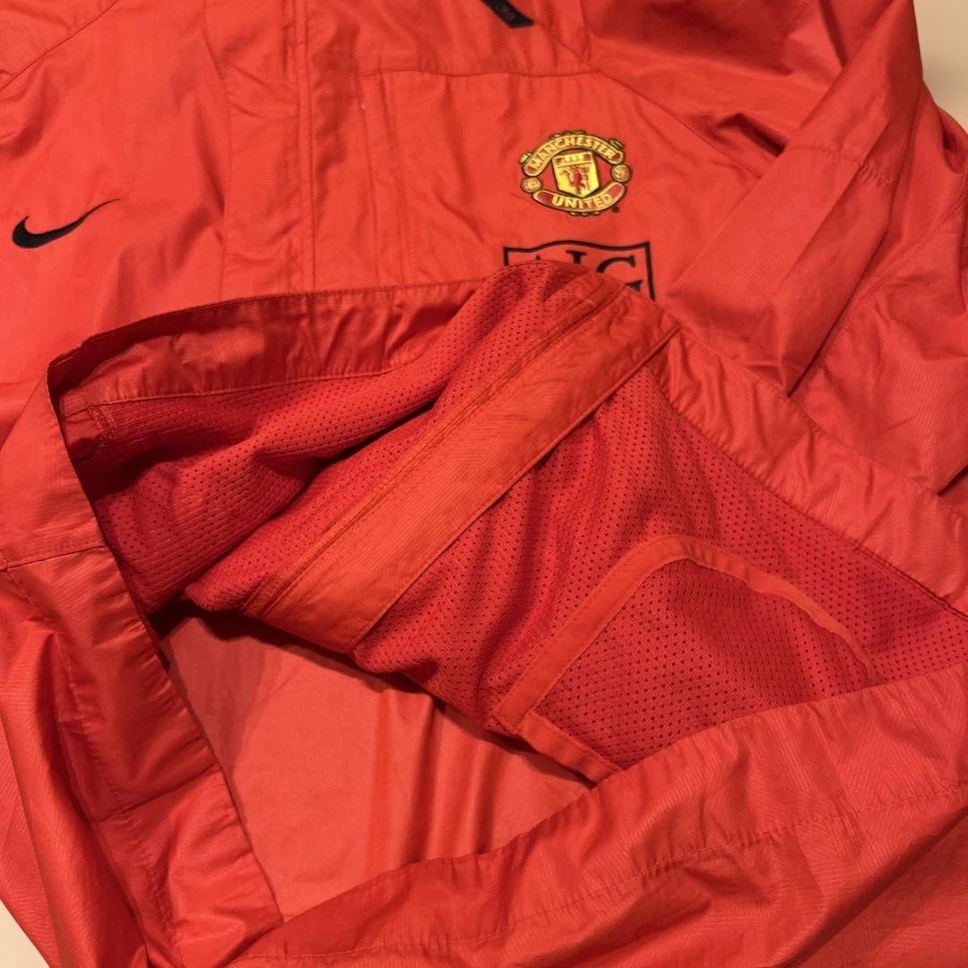 Nike マンチェスター・ユナイテッド ウィンドブレーカー オレンジ