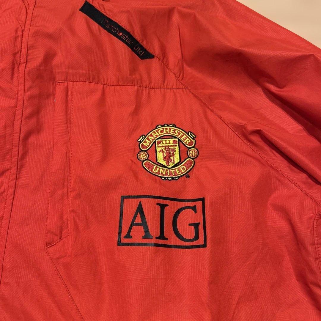 Nike マンチェスター・ユナイテッド ウィンドブレーカー オレンジ