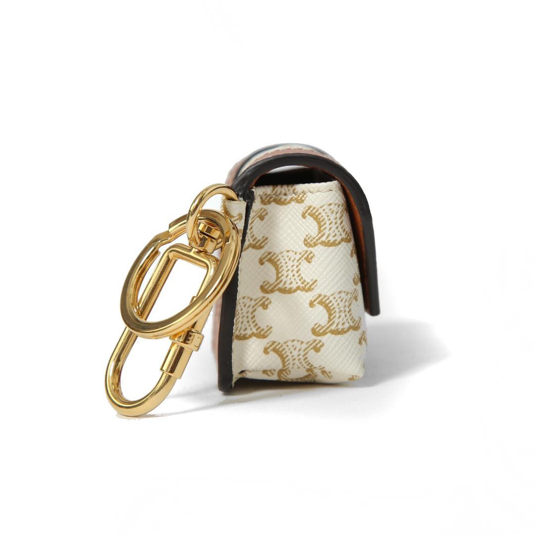 CELINE ミニ バーティカル カバ トリオンフ キャンバス エアポッズケース