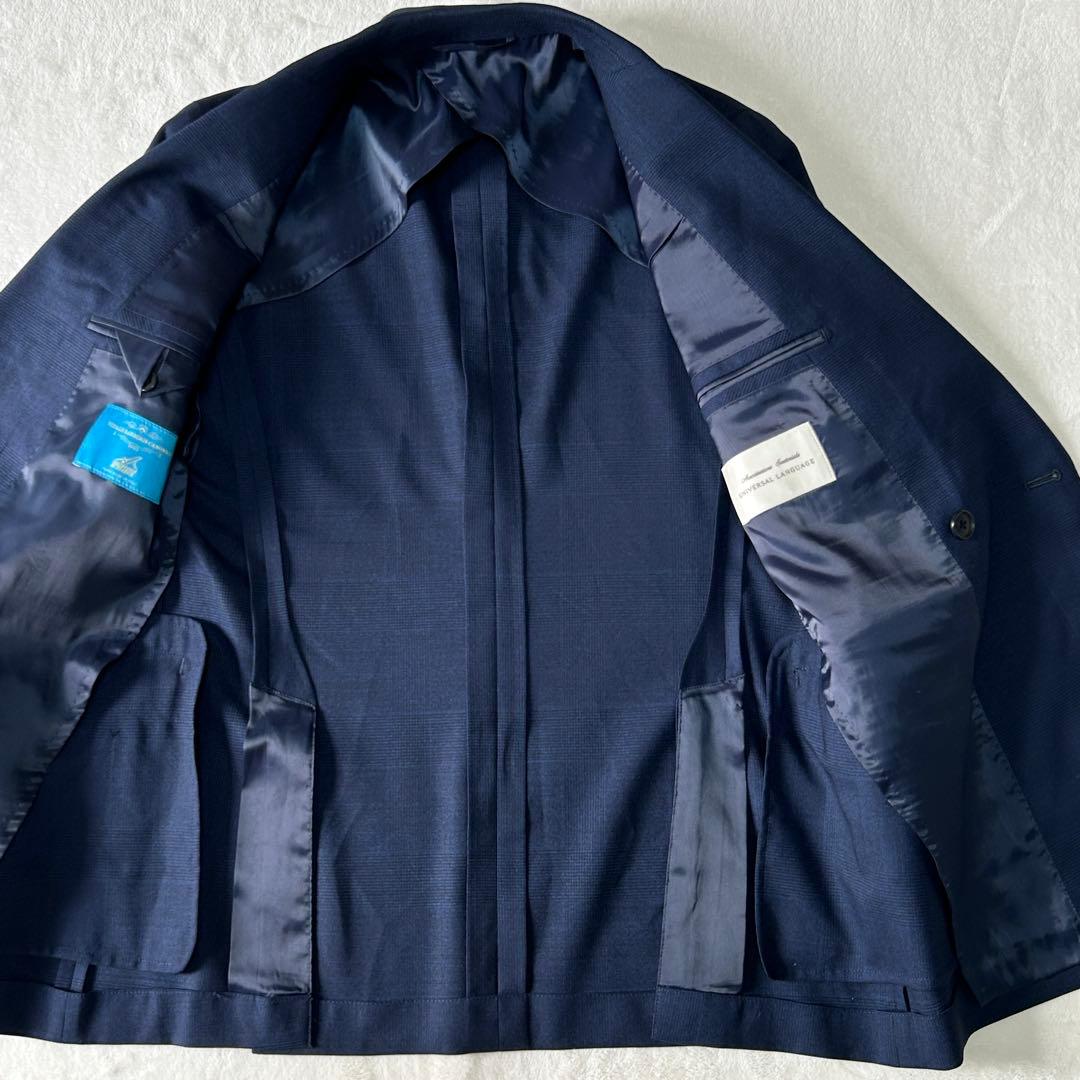 美品 ユニバーサルランゲージ カノニコ スーパーソニック ダブルスーツ M 紺