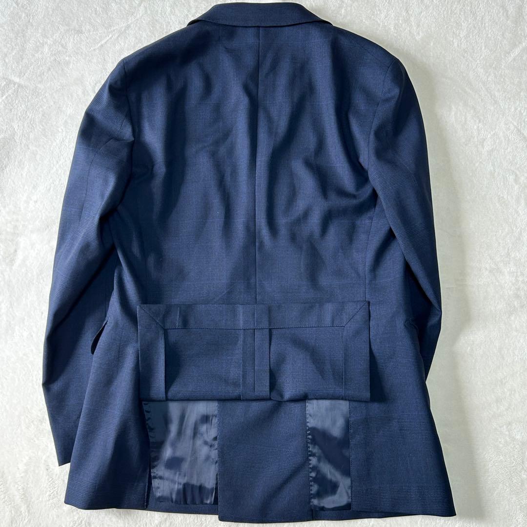 美品 ユニバーサルランゲージ カノニコ スーパーソニック ダブルスーツ M 紺