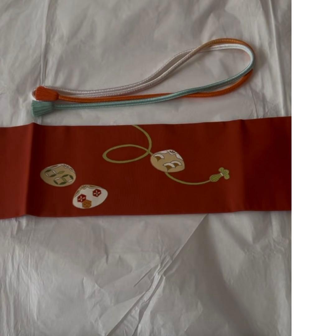 志ま亀　オレンジ地　塩瀬　名古屋帯　貝桶柄