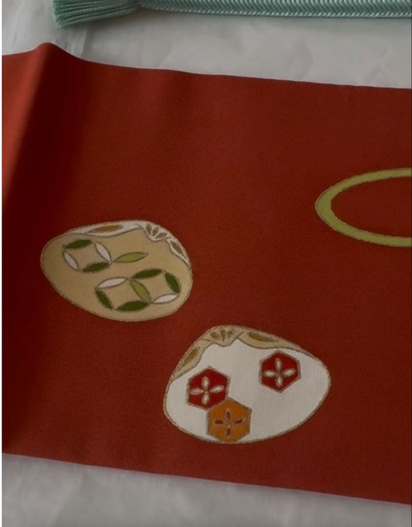 志ま亀　オレンジ地　塩瀬　名古屋帯　貝桶柄