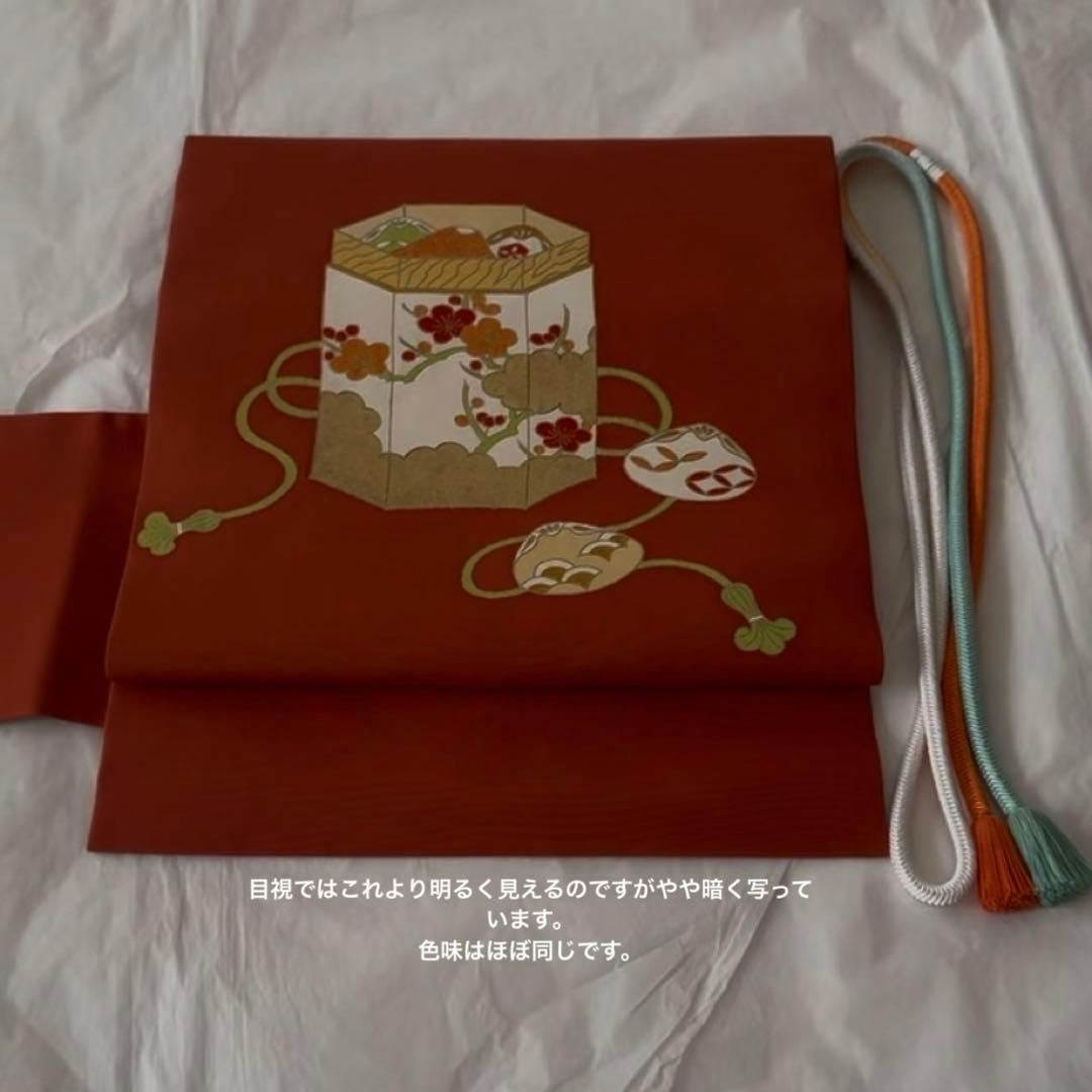 志ま亀　オレンジ地　塩瀬　名古屋帯　貝桶柄