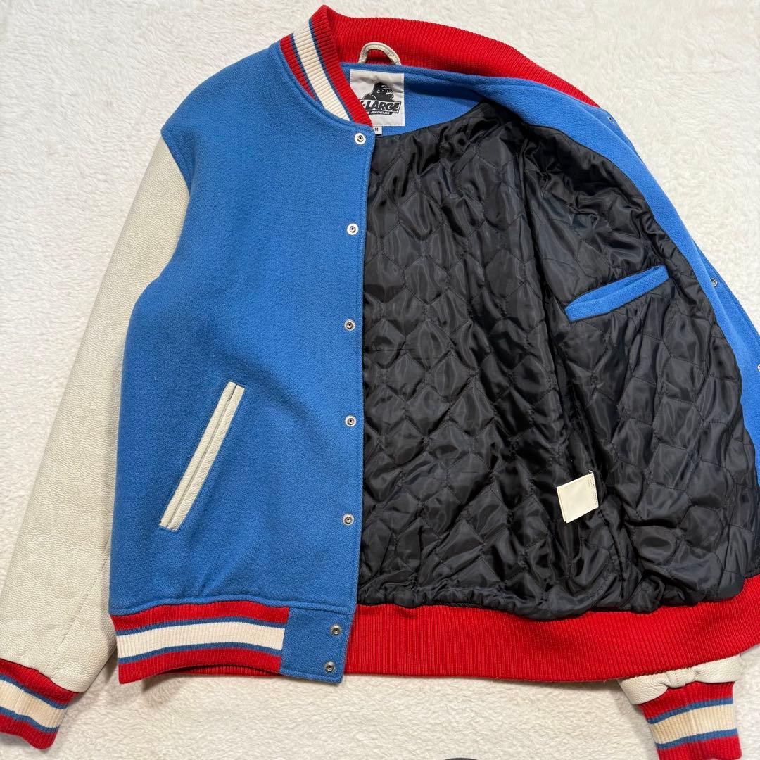 エクストララージ スタジャン パイル生地 刺繍 ブランドロゴ 袖 レザー M