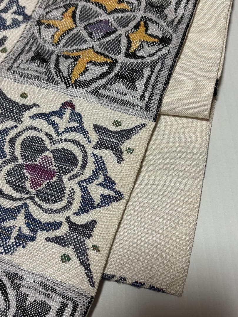 帯屋捨松　白の紬幾何学模様　八寸帯　単にも！