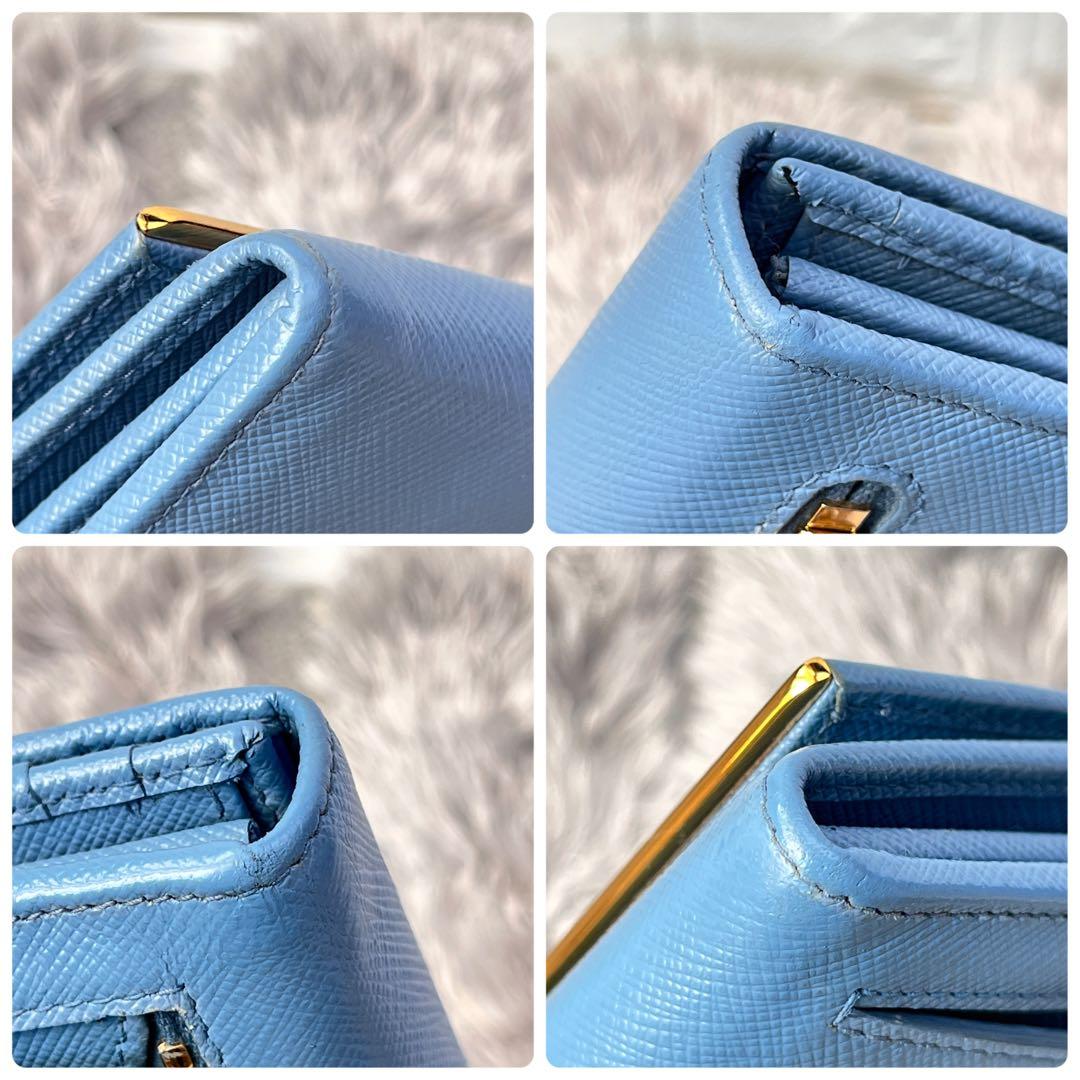 良品✨PRADA メタルバー　メタルロゴ　長財布 サフィアーノ　水色　レディース