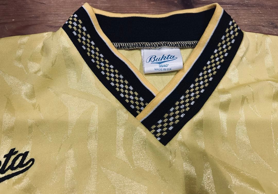 ユニフォーム 古着 90s Bukta バクタ UK製 黄色 Vネック 40
