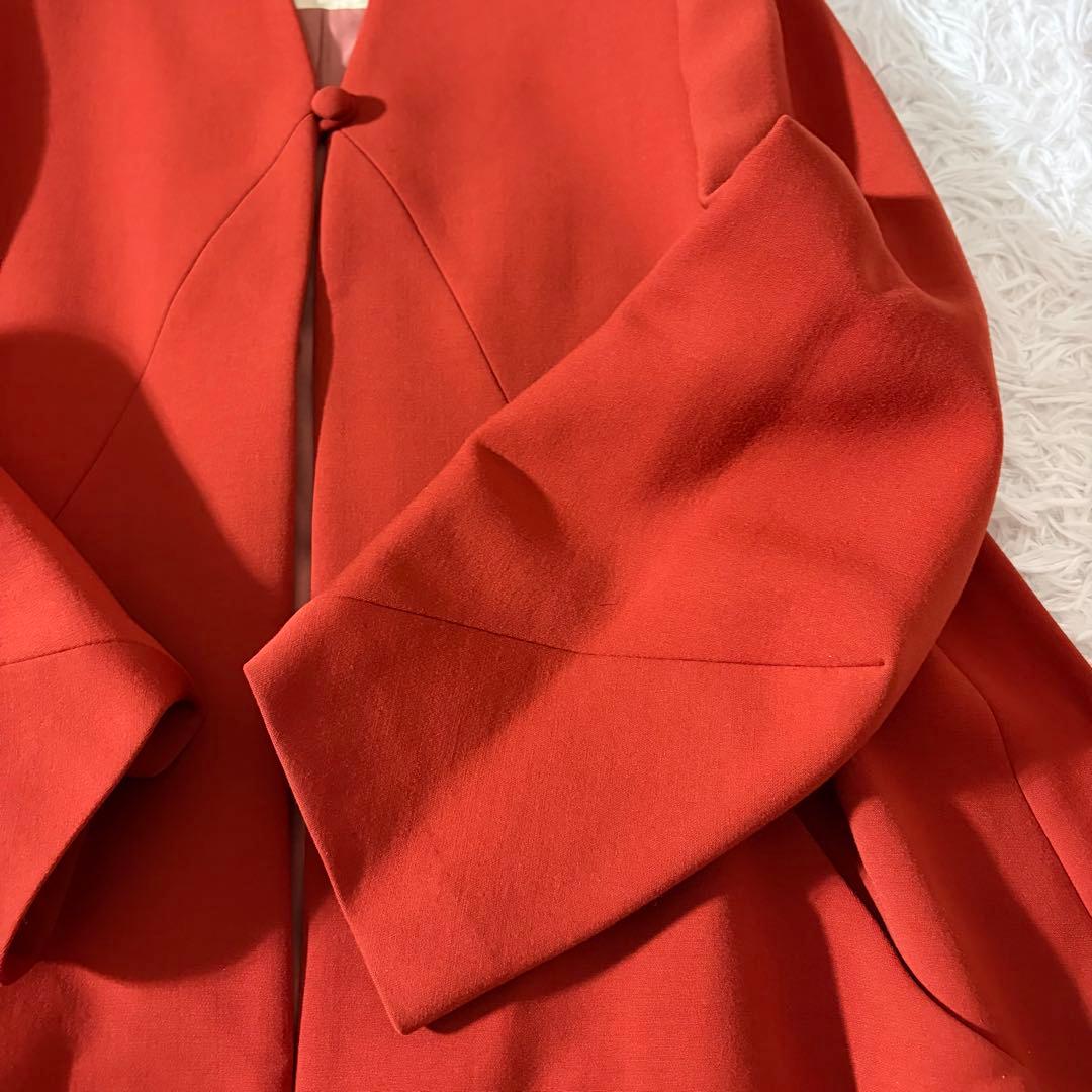 美品 シビラ ノーカラーコート 袖変形 フレア くるみボタン オレンジ