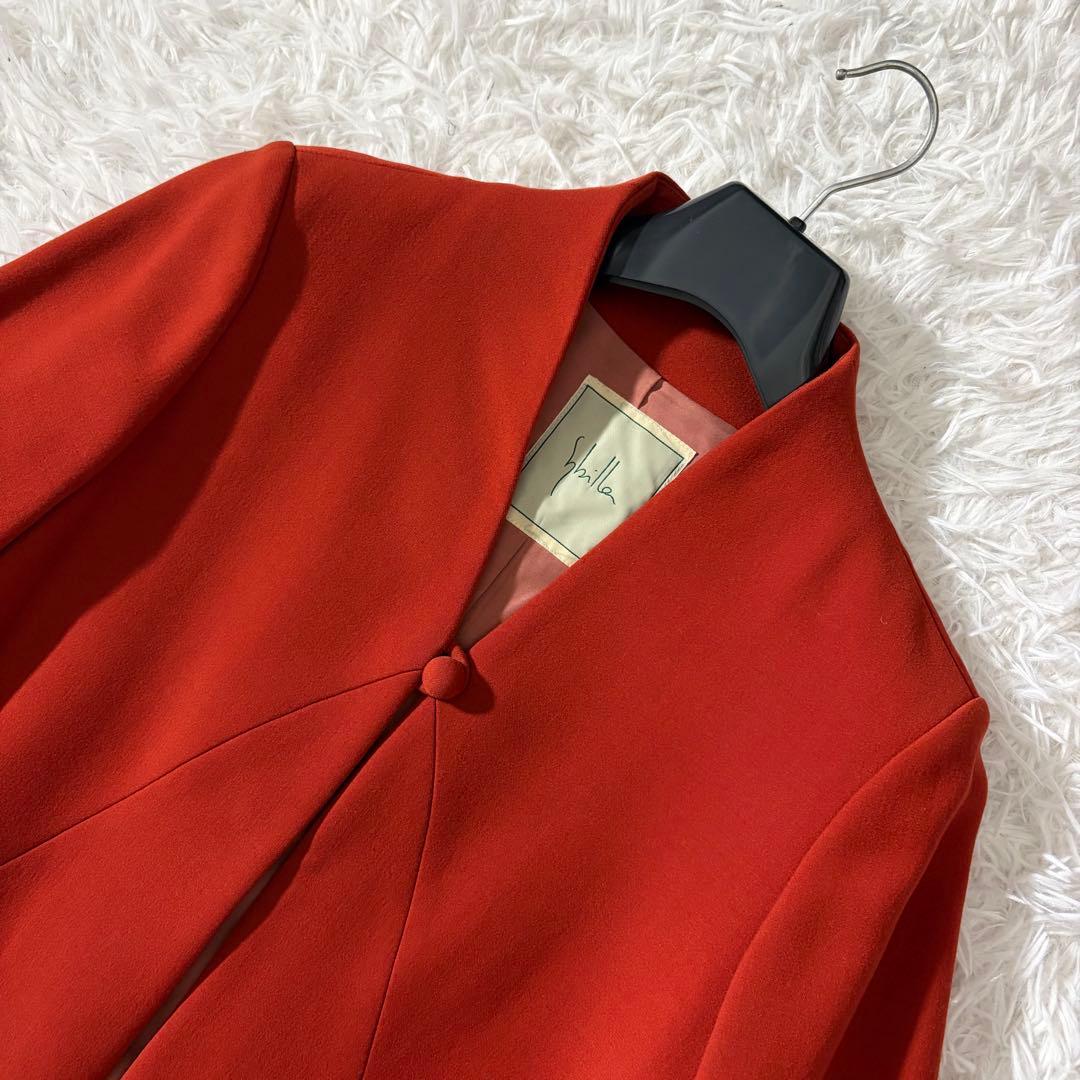 美品 シビラ ノーカラーコート 袖変形 フレア くるみボタン オレンジ