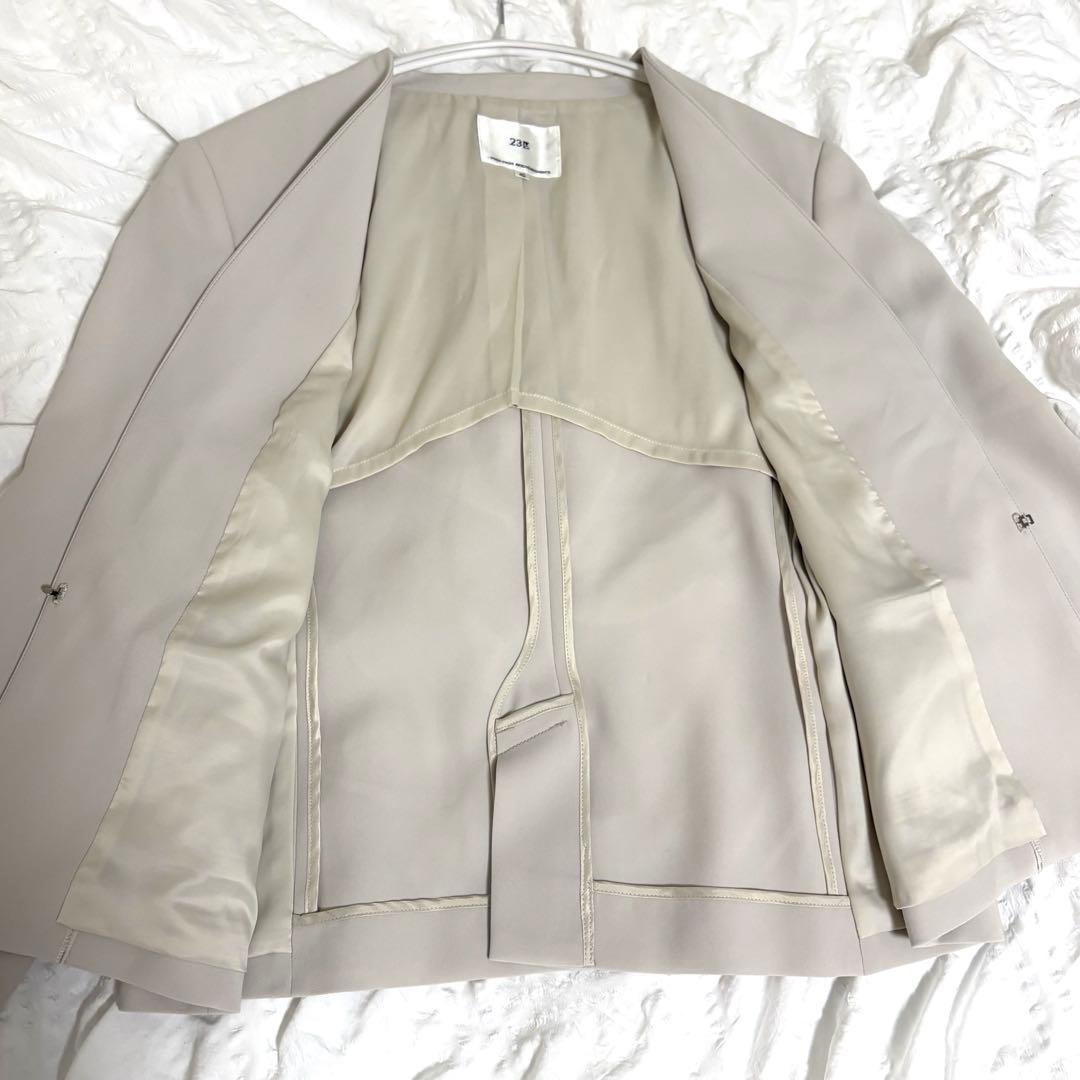 23区 トリアセダブルジョーゼット ノーカラージャケット 40 L ベージュ