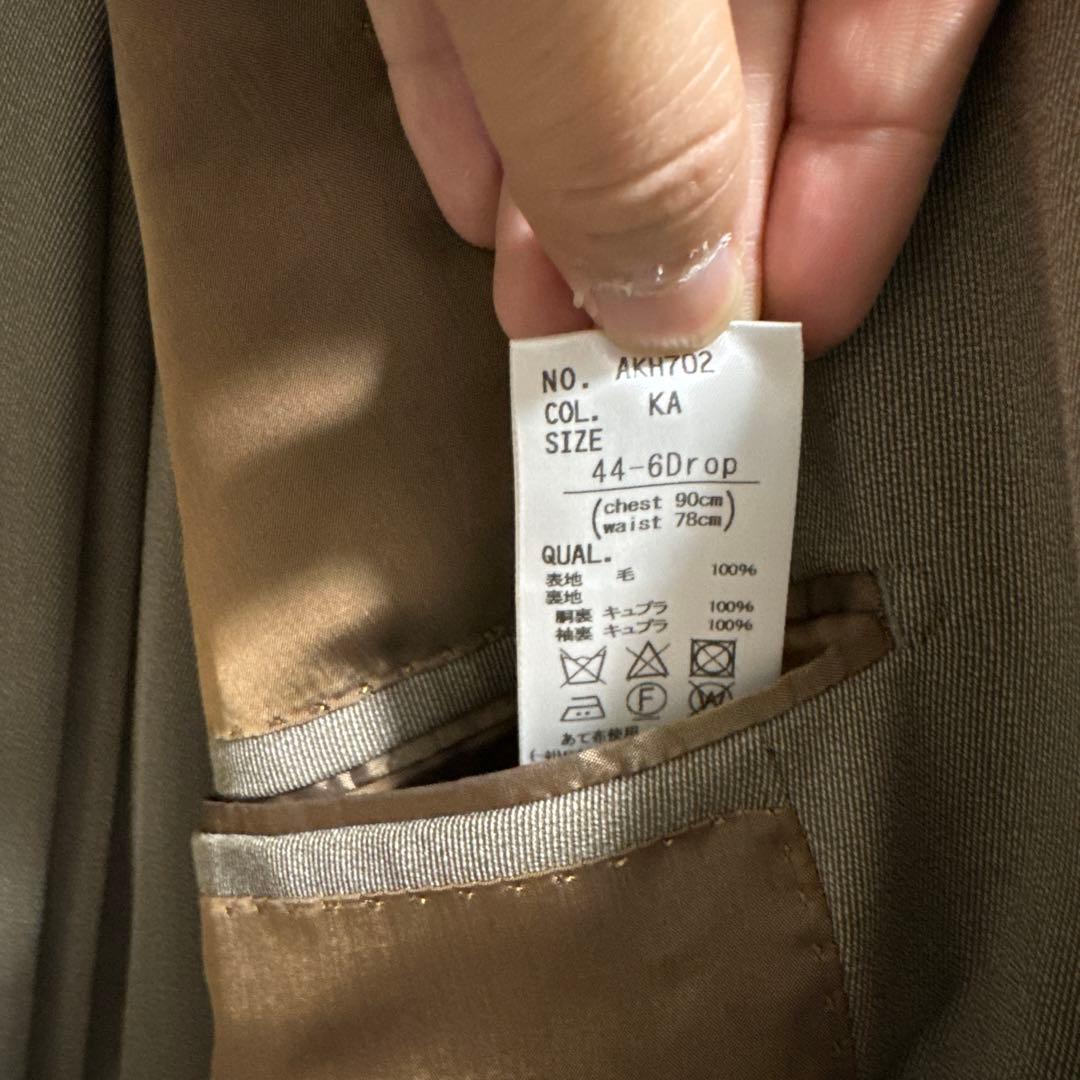 ユニバーサルランゲージ　カノニコカバード　ベージュダブルスーツ