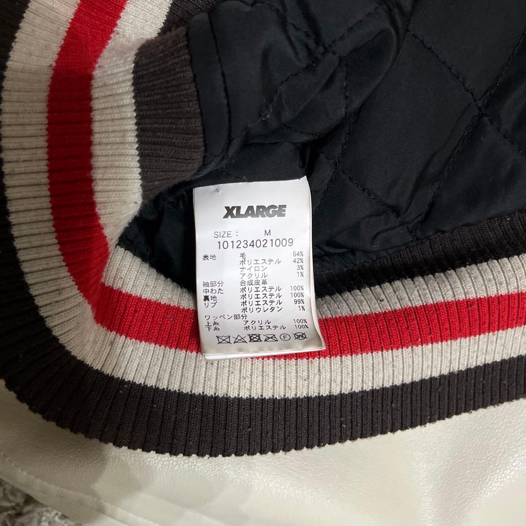 XLARGE ダークブラウン スタジャン Ｍ 袖に汚れあり　毛玉あり