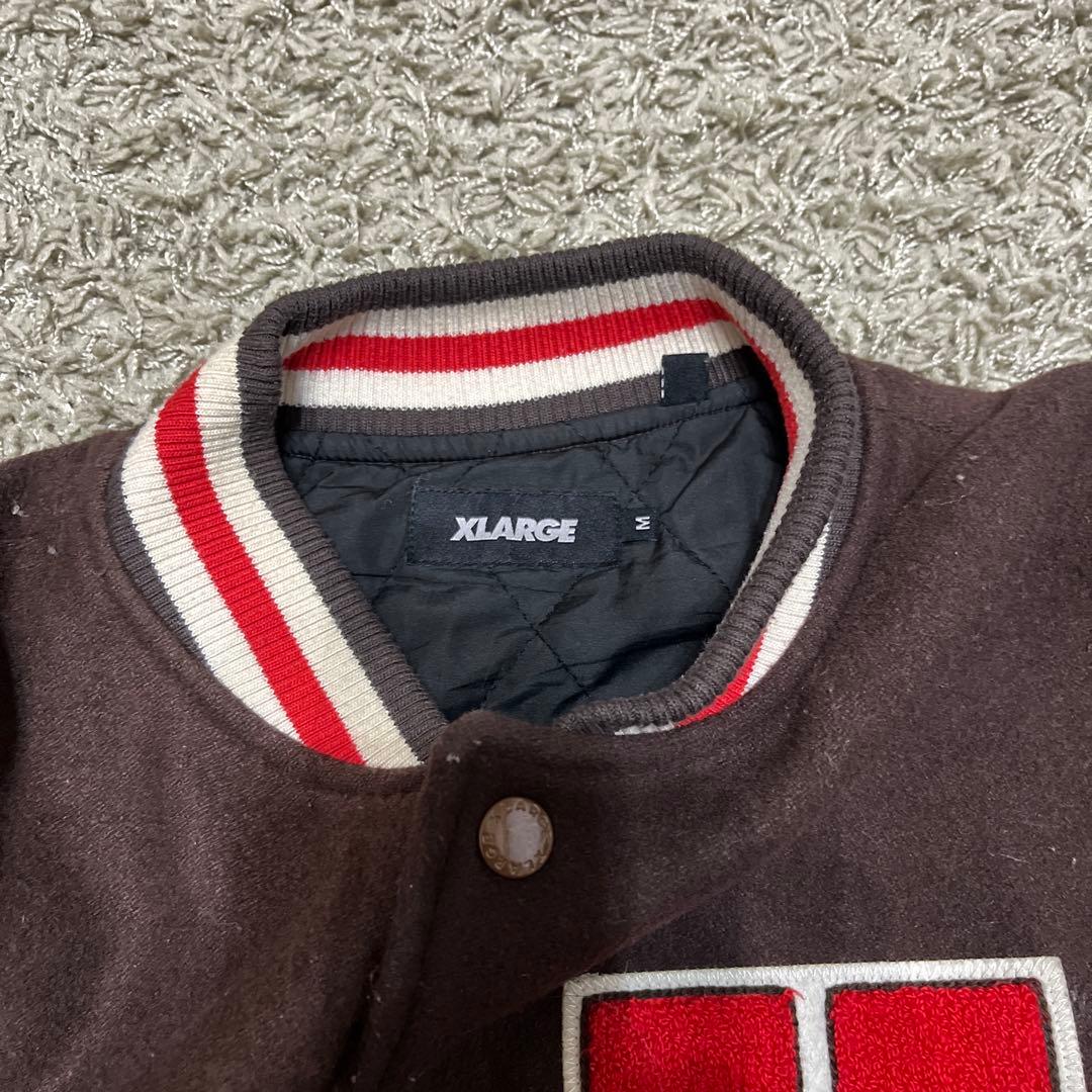 XLARGE ダークブラウン スタジャン Ｍ 袖に汚れあり　毛玉あり