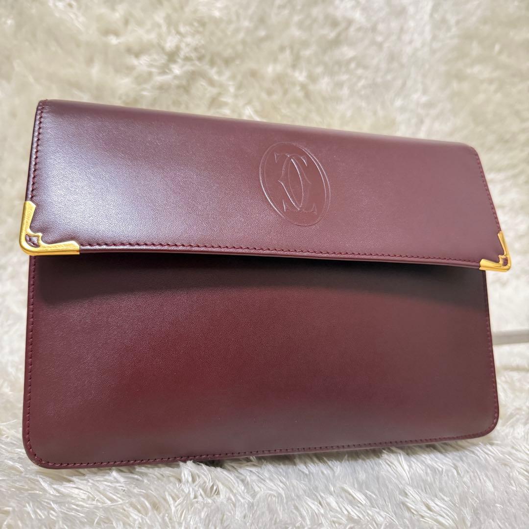 カルティエ　マストライン　クラッチバッグ　ボルドー　ロゴ金具