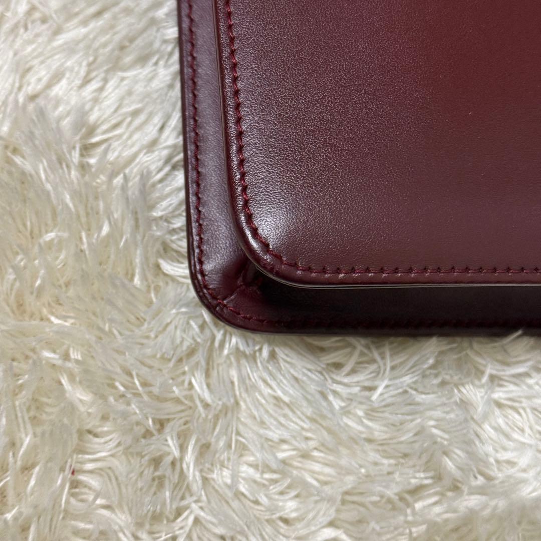 カルティエ　マストライン　クラッチバッグ　ボルドー　ロゴ金具