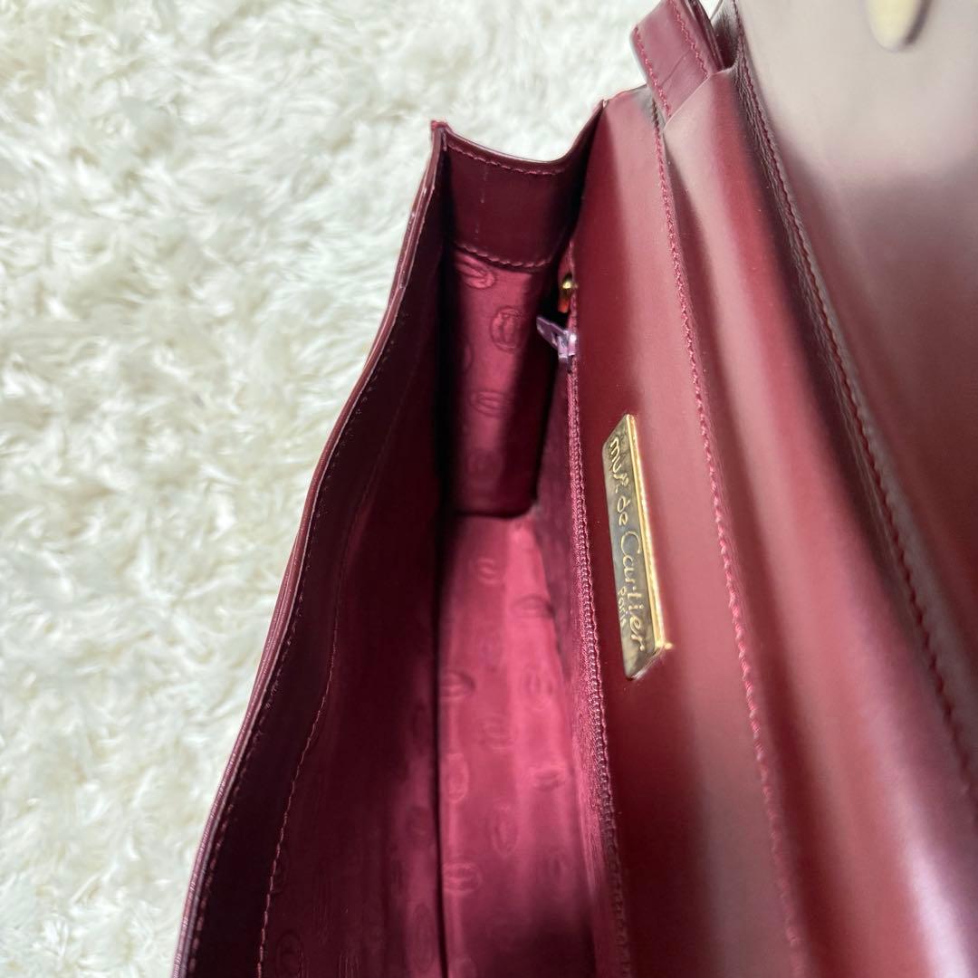 カルティエ　マストライン　クラッチバッグ　ボルドー　ロゴ金具