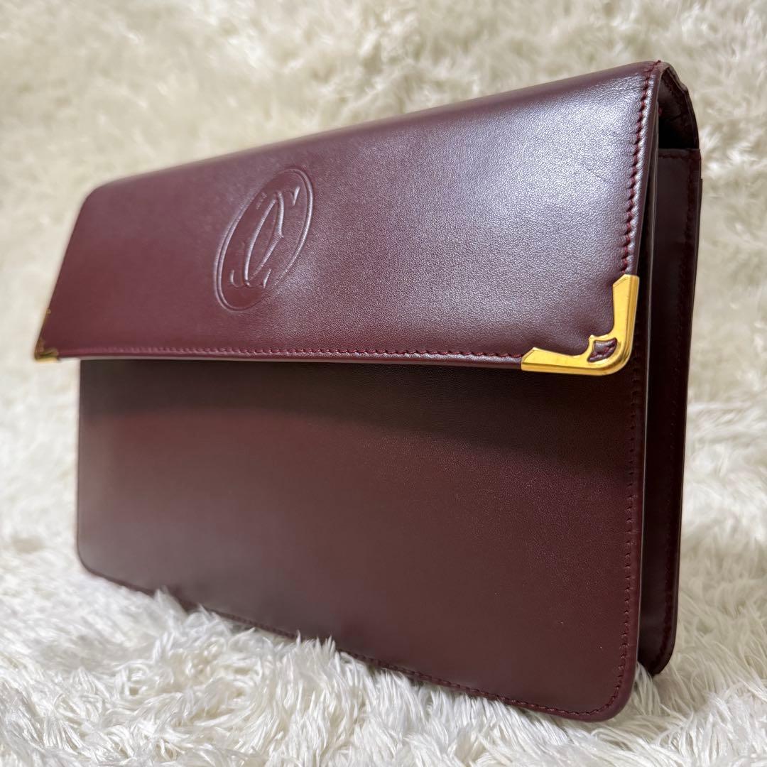 カルティエ　マストライン　クラッチバッグ　ボルドー　ロゴ金具