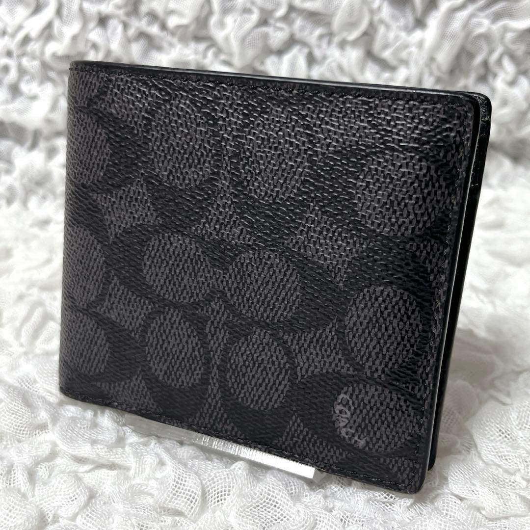 コーチ　シグネチャー　ブラック　レザー　二つ折り　財布　小銭入れ付　コンパクト