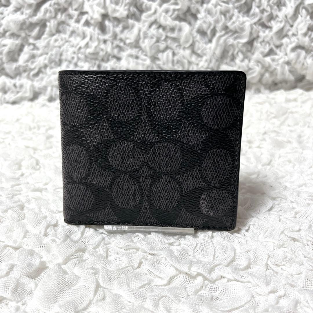 コーチ　シグネチャー　ブラック　レザー　二つ折り　財布　小銭入れ付　コンパクト