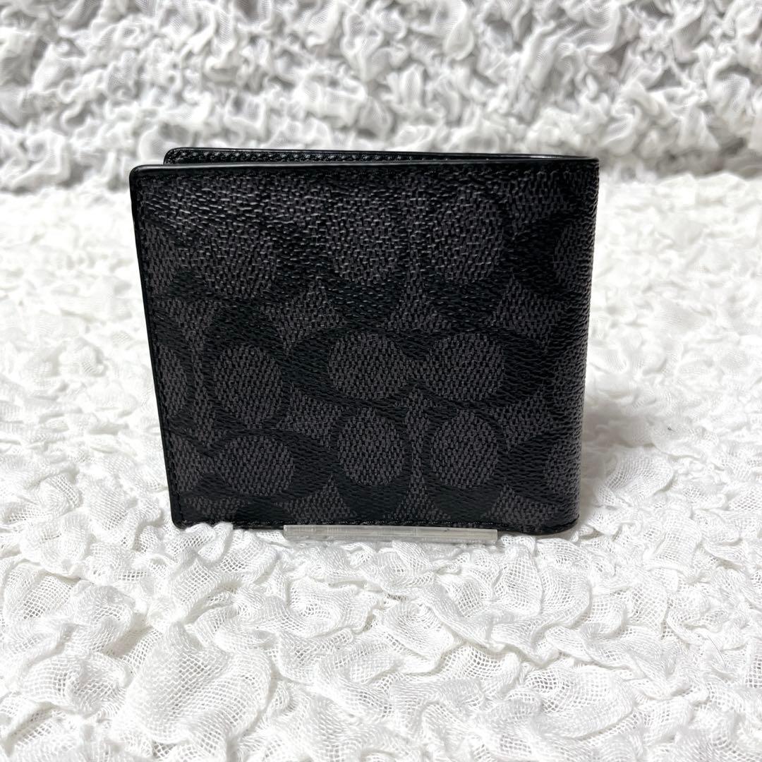コーチ　シグネチャー　ブラック　レザー　二つ折り　財布　小銭入れ付　コンパクト