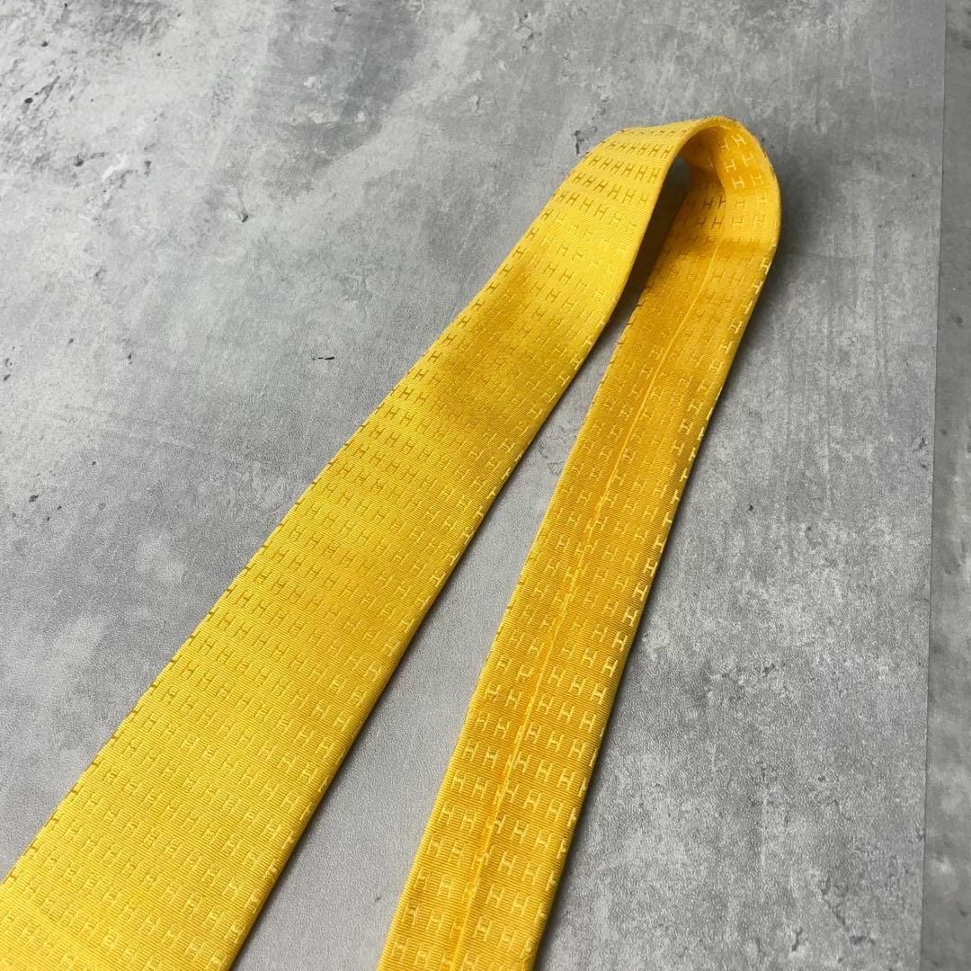 美品 HERMES エルメス H柄 総ロゴ ファソネ ネクタイ イエロー 黄