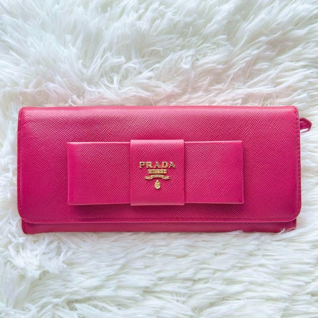 美品✨プラダ 長財布 サフィアーノ フィオッコ ピンク メタルロゴ リボン