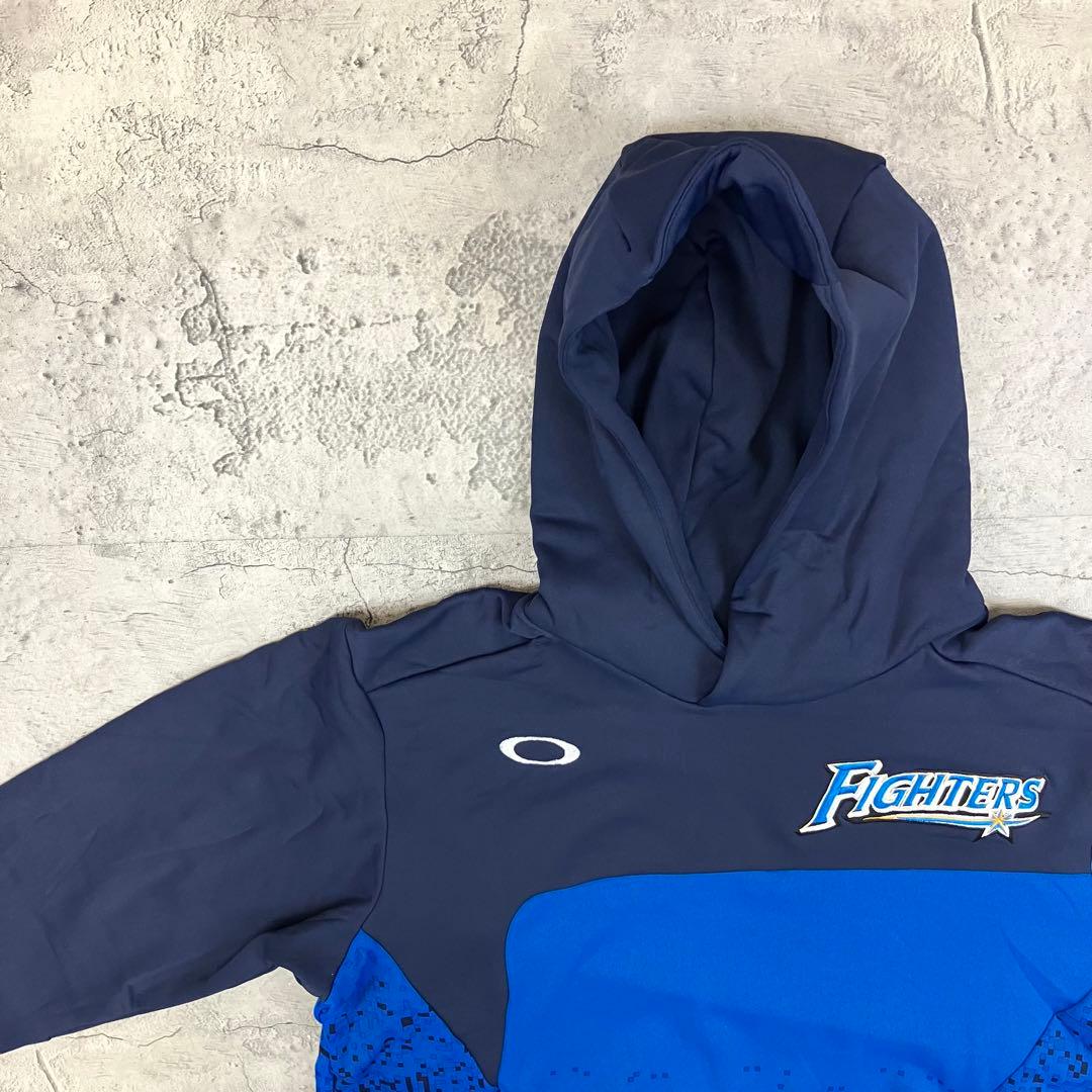 北海道日本ハムファイターズ フリースパーカー オークリー 古着 刺繍 紺青 XL