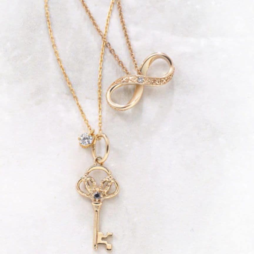 agete　アガット　K10　インフィニティ&リボン　チャーム　鏡リュウジ