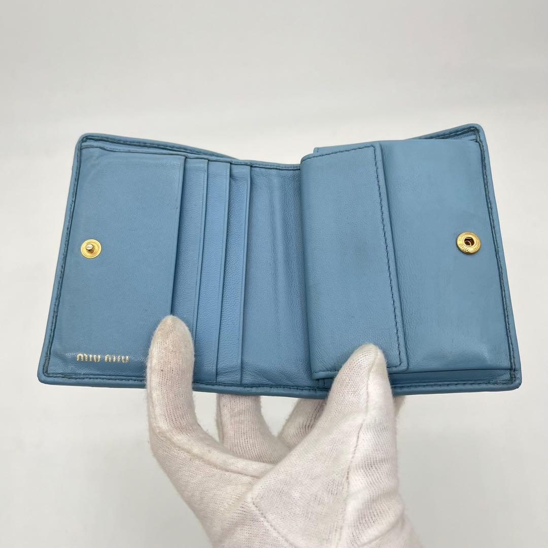 ミュウミュウ 二つ折り財布 マテラッセ クリスタル ビジュー ロゴ金具 レザー
