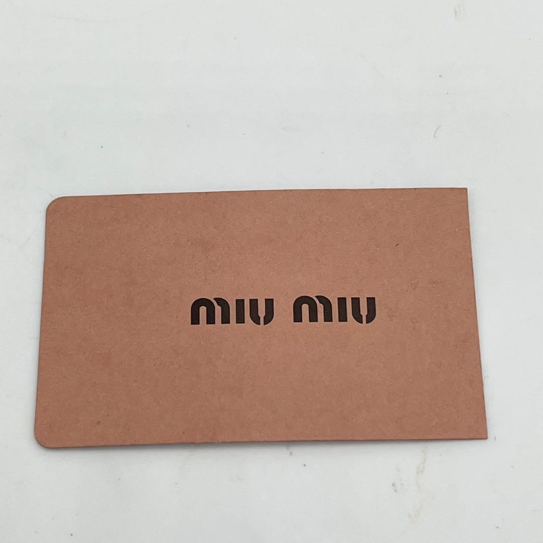 ミュウミュウ 二つ折り財布 マテラッセ クリスタル ビジュー ロゴ金具 レザー