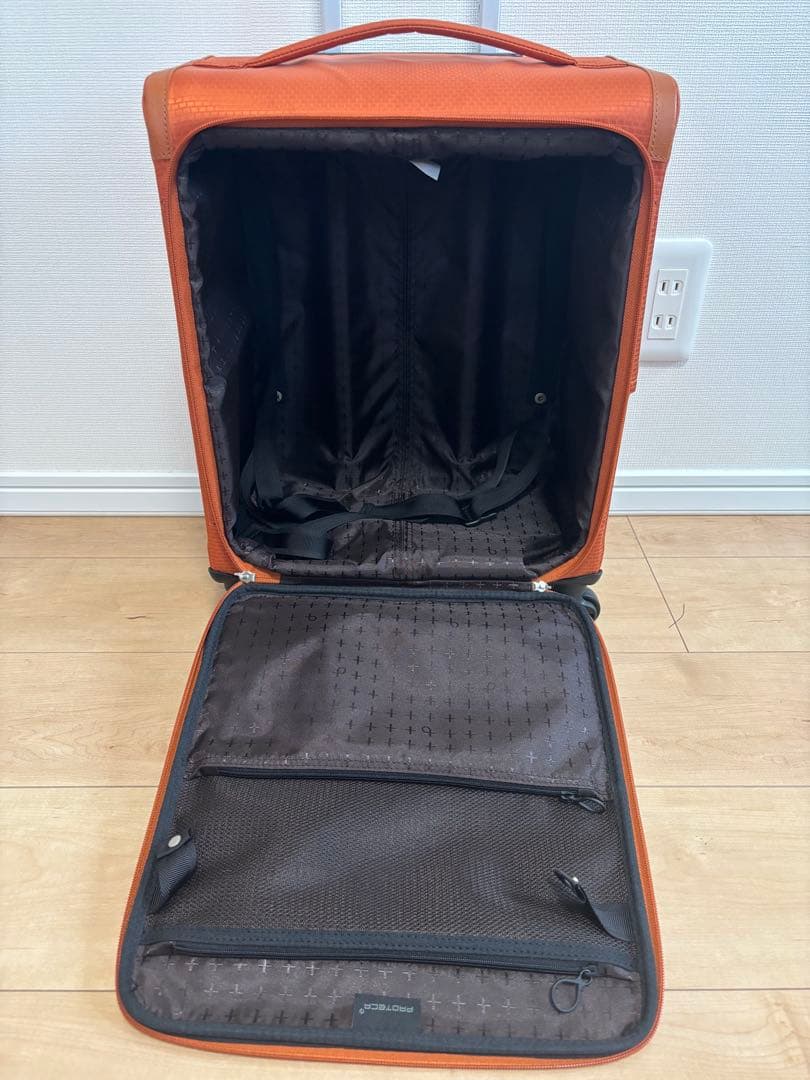 プロテカ　オレンジ キャリーケース 4輪 前面ポケット付き