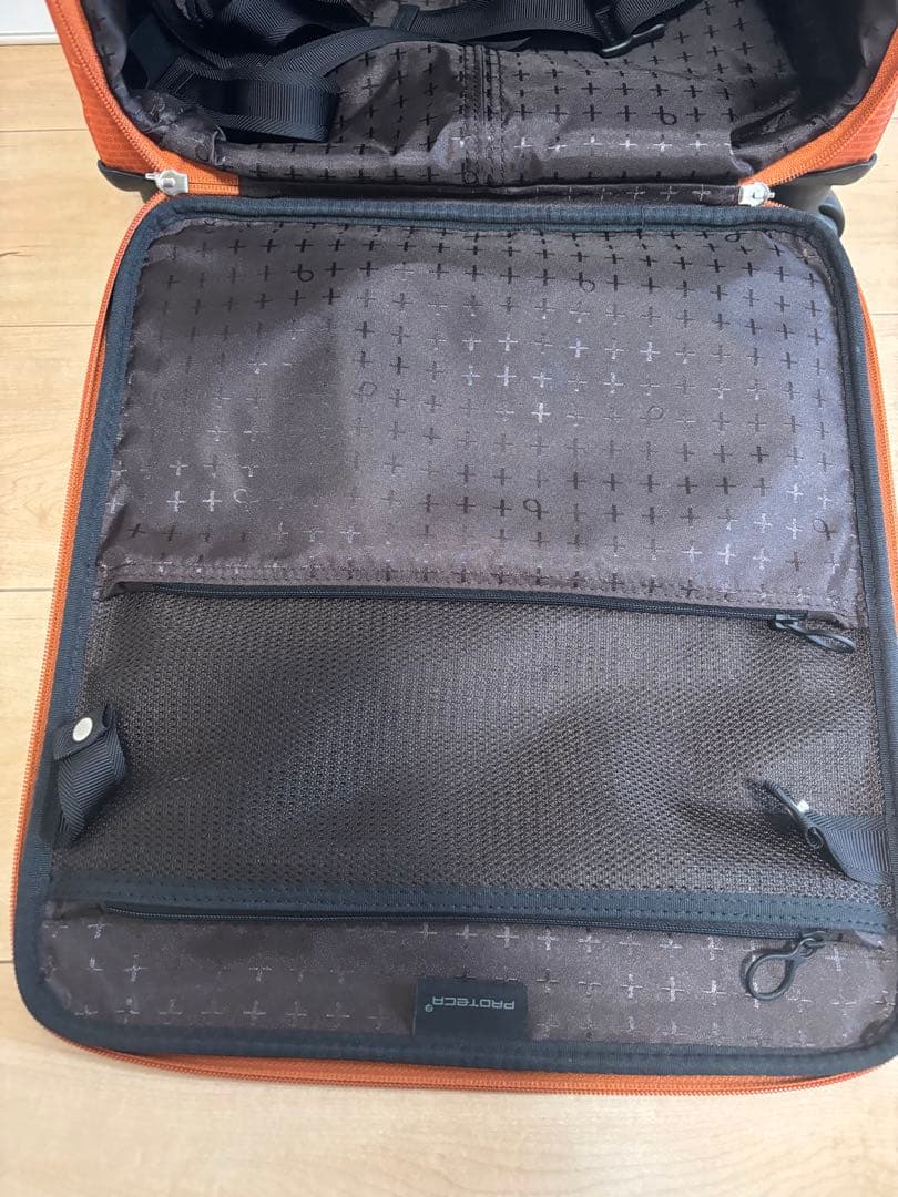 プロテカ　オレンジ キャリーケース 4輪 前面ポケット付き