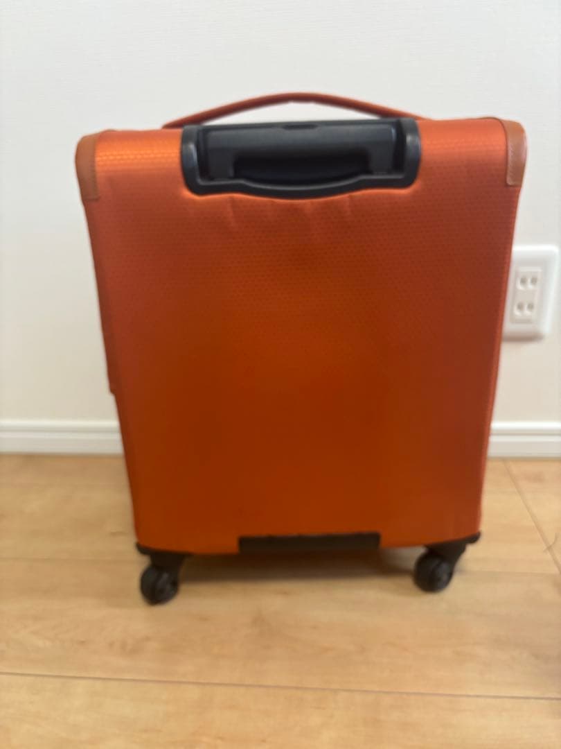 プロテカ　オレンジ キャリーケース 4輪 前面ポケット付き