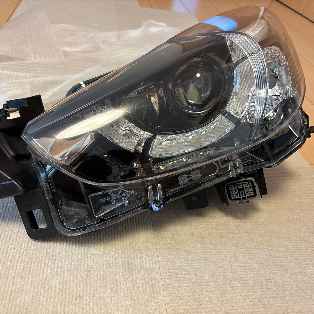 DJデミオ　左ヘッドランプ