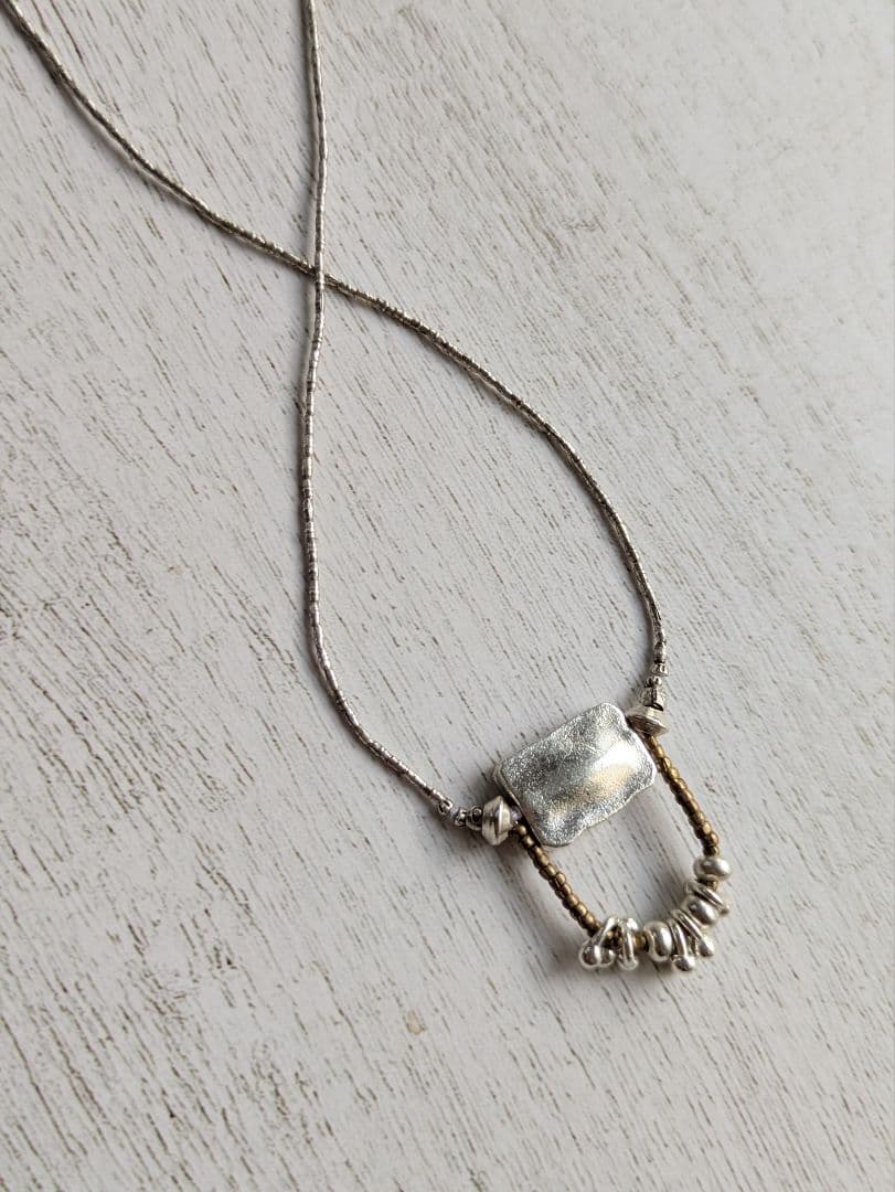 カレンシルバーのペンダントネックレス