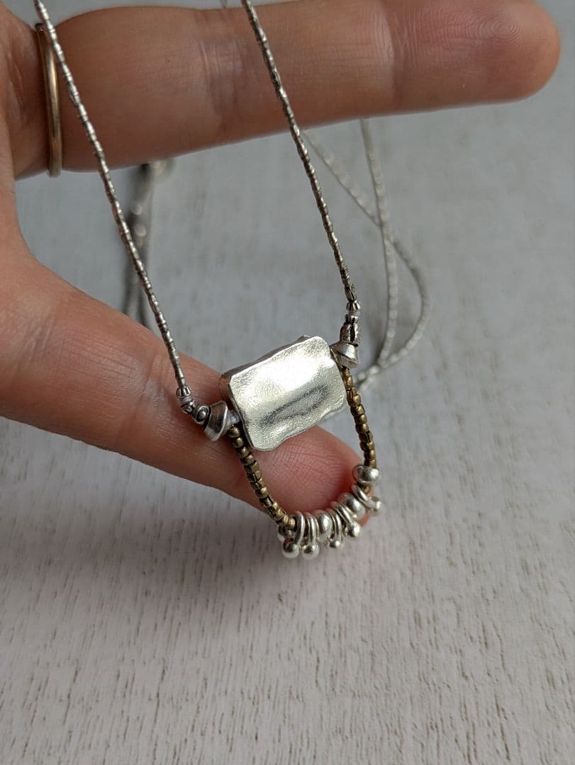 カレンシルバーのペンダントネックレス